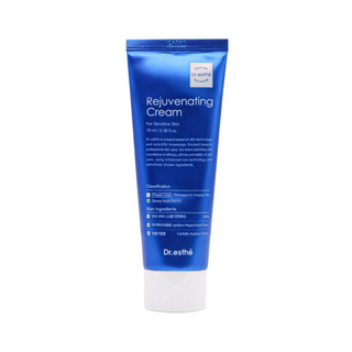 A blue squeeze tube of Dr. esthé Rejuvenating Cream for sensitive skin, featuring white text and a white cap, set against a plain white background.