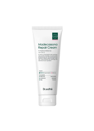 A white squeeze tube of Dr. esthé Madecassona Repair Cream on a plain white background.
