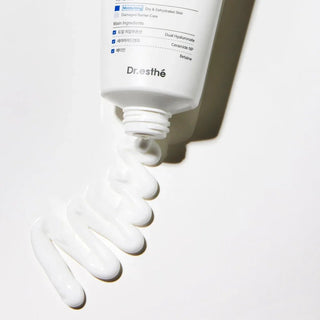 Dual Barrier Cream Dr.Esthe  , White skincare product tube with visible brand name on a light background