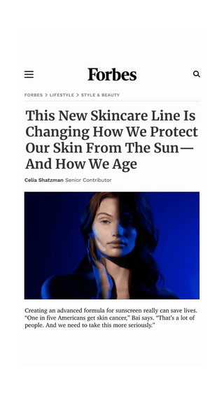 A Forbes article screenshot with the headline 'This New Skincare Line Is Changing How We Protect Our Skin From The Sun— And How We Age' by Celia Shatzman, featuring a blue-lit portrait of a woman and a quote about sunscreen.