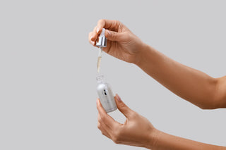 IS Clinical Brightening Serum With Model Hands