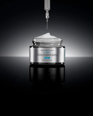  SkinCeuticals P-TIOX Cream Skincare cream jar with a syringe dispensing cream on a dark background