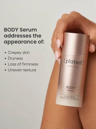 Plated body serum bottle held by a hand with text about skin issues addressed.