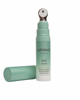 Plated eye serum bottle on a white background