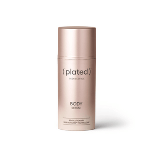 Plated body serum bottle on a white background
