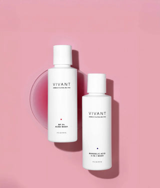 Two white VIVANT skincare bottles on a pink background, one labeled BP 3% ACNE WASH and the other Vivant BP 3 Acne Wash Mandelic Acid Wash