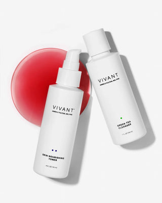 Two white skincare bottles from VIVANT, including Skin Nourishing Toner and Green Tea Cleanser, arranged on a light gray background with a translucent pink circular prop.